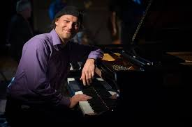Ira Friedman at the piano in his teaching studio